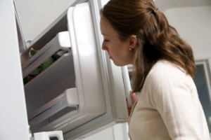 "Woman-looking-in-freezer"